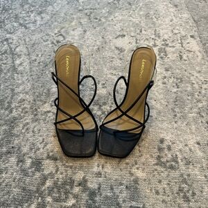 Lemonade black strappy heels with clear straps and a square toe,